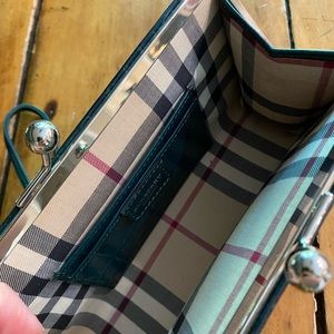 Burberry kiss lock wristlet/clutch.